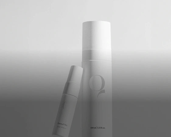Skincare products in white on gradient background