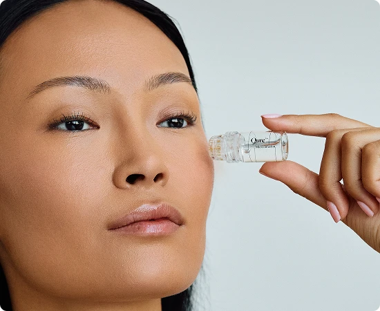 Woman using dual-action skincare product