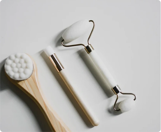 face brush, makeup brush, and jade roller.